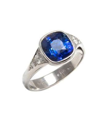 Cushion Cut Blue Sapphire Lunette Style Ring in Platinum